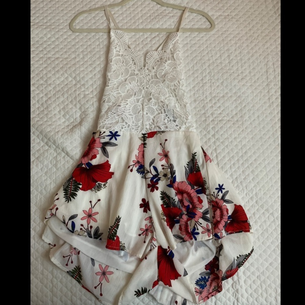 Floral lace romper. Thin straps and open back.
